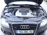 a car with its hood open and the engine in the back
