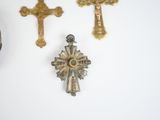 several crosses are displayed on a white surface with a white background