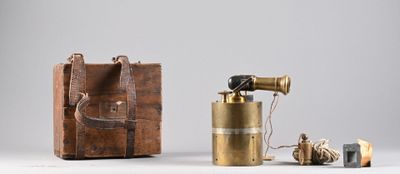 a small wooden box with a camera and some other items
