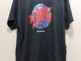 a black t - shirt with the planet earth logo on it