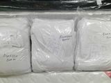 four bags of toilet paper wrapped in plastic