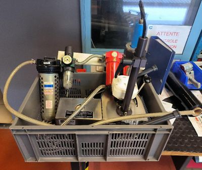 a metal box with a bunch of tools on top of it