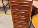 an image of a wooden chest of drawers in a store