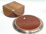 two wooden coasters with a metal base and a wooden box