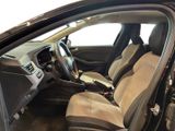 the interior of a car with the door open and the driver ' s seat down