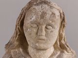 statue of a woman with her eyes closed and her eyes closed