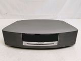 a close up of a black cd player on a white surface