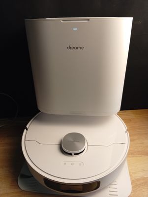 a white air purifier sitting on top of a wooden table