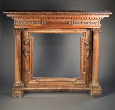 an image of a wooden fireplace with carvings on top of it