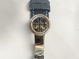a watch that is sitting on top of a blue strap