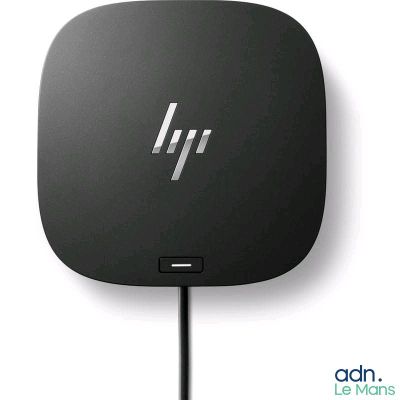 a close up of a small black device on a white surface