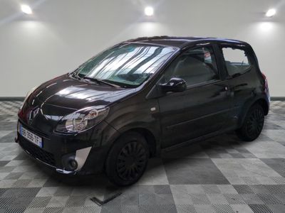 the small black car is parked on a checkered floor