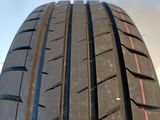 a close up of a tire with a red stripe on it