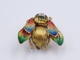an image of a gold and enamel insect broochle