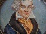 portrait of a man in a blue coat with a yellow tie