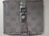 a small wallet with a metal clasp on it
