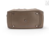 brown leather handbag with rivets and rivets on the front