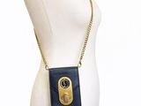 a close up of a mannequin torso with a purse on it