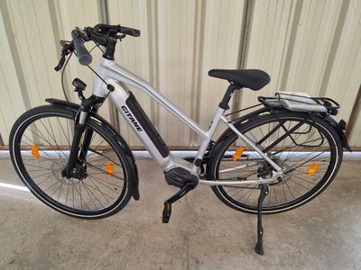 a bike that is parked next to a wall