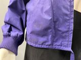 an image of a mannequin wearing a purple jacket and black skirt