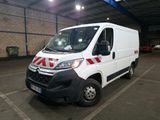 a white van that is parked in a parking lot