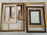 four different colored picture frames on the wall