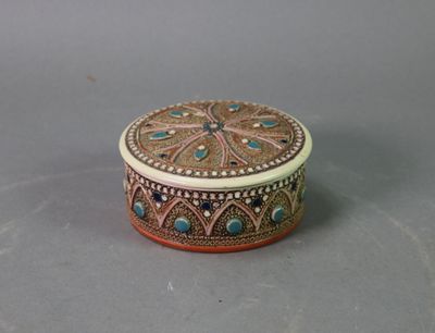 an ornately decorated box sitting on top of a table