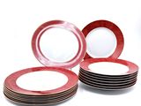 several red and white plates are stacked on top of each other