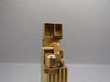 a gold lighter that is sitting on a table