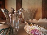 a vase and a bowl sitting on a table