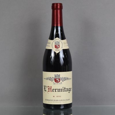 a bottle of wine that is sitting on a table