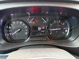 a close up of a car dashboard with a speedometer and gauges