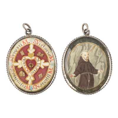an image of two pendants with a picture of a man holding a cross and a heart