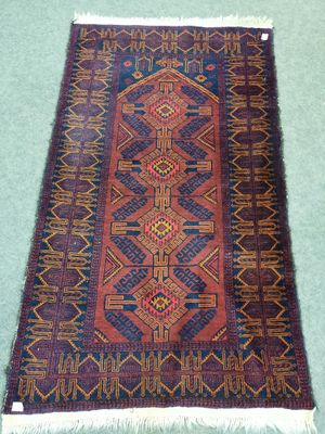 a close up of a rug on a green surface