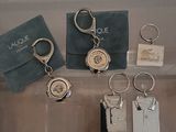 a lot of keychains that are sitting on a table