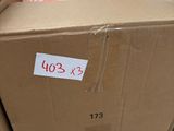a cardboard box with a price tag on it in a warehouse