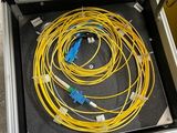 a suitcase with a bunch of cables inside of it