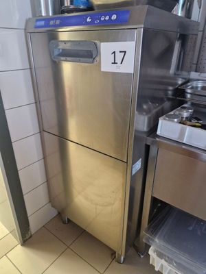 a stainless steel refrigerator in a kitchen with a number on the door