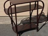 a small table that has a shelf on top of it