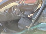 the interior of a car with the door open showing the driver ' s seat
