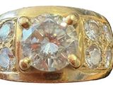 an image of a gold ring with a diamond in the center