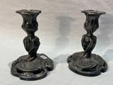 two candles that are sitting on top of each other