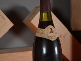 a bottle of wine that is sitting on a table