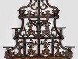 an old wooden shelf with a decorative design on it