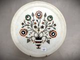 a white plate with a floral design on it