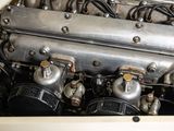 a close up of an old car engine with a lot of wires