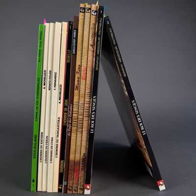 books stacked on top of each other on a gray surface