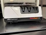 a white and black electric knife sharper on top of a counter