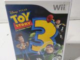 a close up of a wii game with a toy story 3 cover