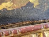 a close up of a painting of a horse on a table